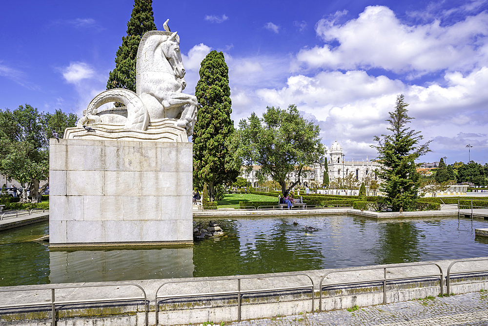 View of Jerónimos Monastery (Monastery of the Hieronymites) from Empire Square Garden on a sunny day, Lisbon, Portugal, Europe