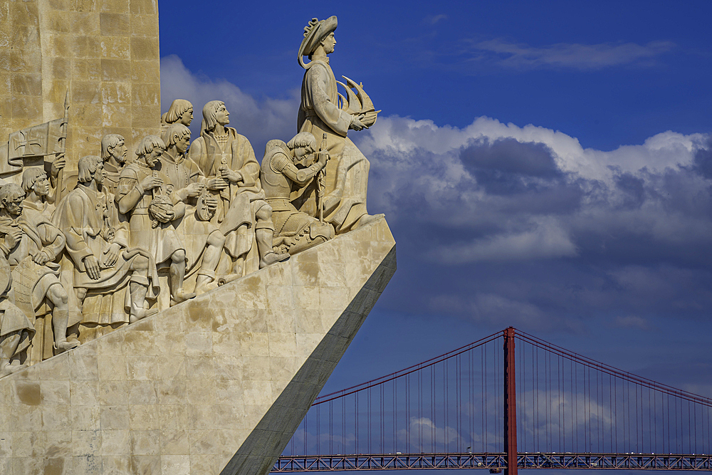 View of Monument to the Discoveries (Padrão dos Descobrimentos) and 25 April Bridge on a sunny day, Lisbon, Portugal, Europe