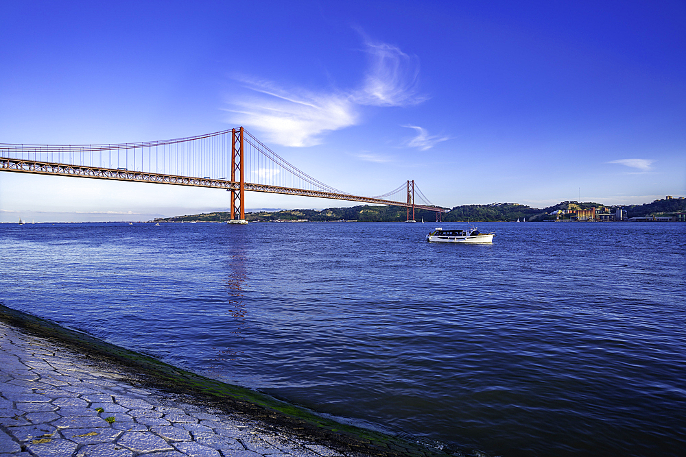 View of Tagus river 25 April Bridge on a sunny day, Lisbon, Portugal, Europe