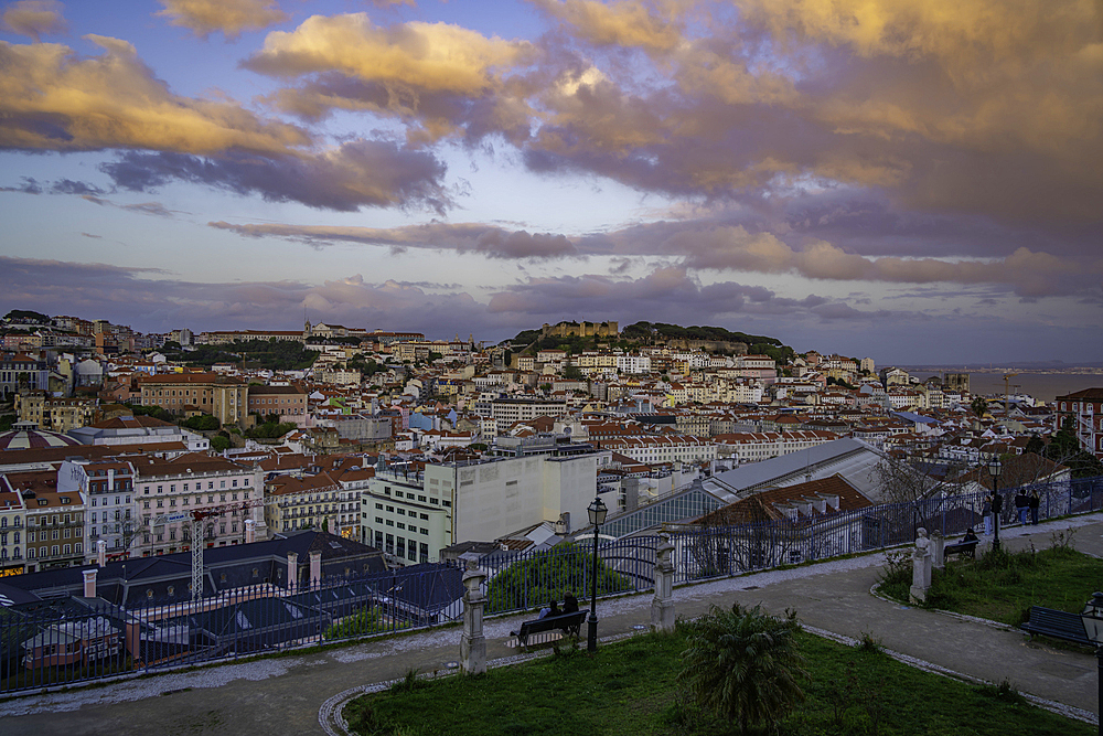 View of Lisbon from Miradouro de Sao Pedro de Alcantara at sunset, Lisbon, Portugal, Europe