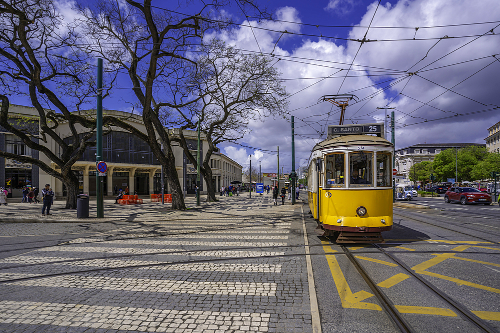 View of vintage yellow tram in PC Duque da Terceira on a sunny day, Lisbon, Portugal, Europe