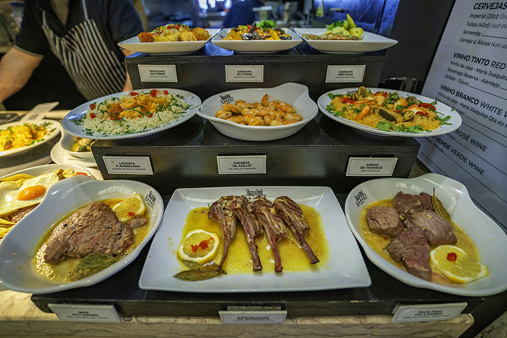 View of food on display in the food court in the interior of Time Out Market, Lisbon, Portugal, Europe