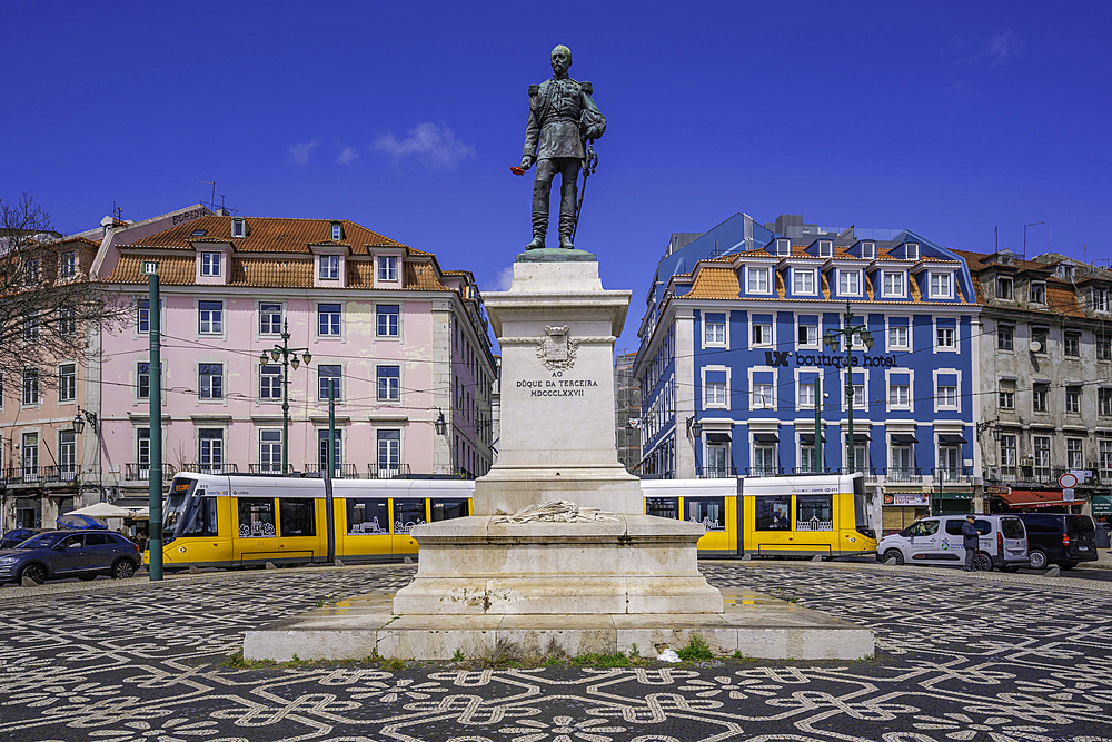 View of Duke of Terceira statue and a modern tram in PC Duque da Terceira on a sunny day, Lisbon, Portugal, Europe
