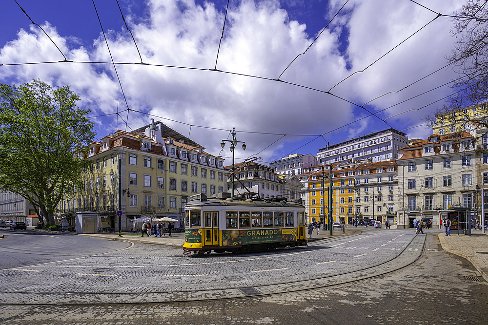 View of a vintage tram in PC Duque da Terceira on a sunny day, Lisbon, Portugal, Europe