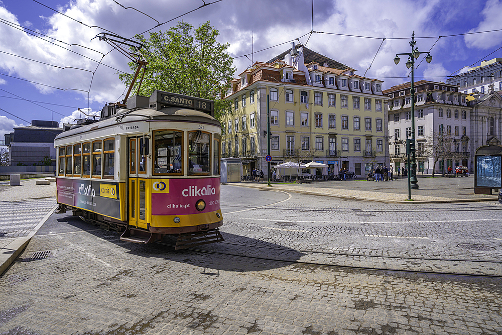 View of a vintage tram in PC Duque da Terceira on a sunny day, Lisbon, Portugal, Europe