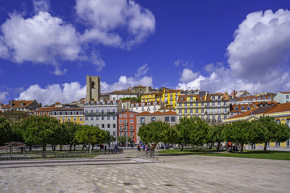 View of Lisbon Cathedral and colourful buildings in the Alfama District on a sunny day, Lisbon, Portugal, Europe