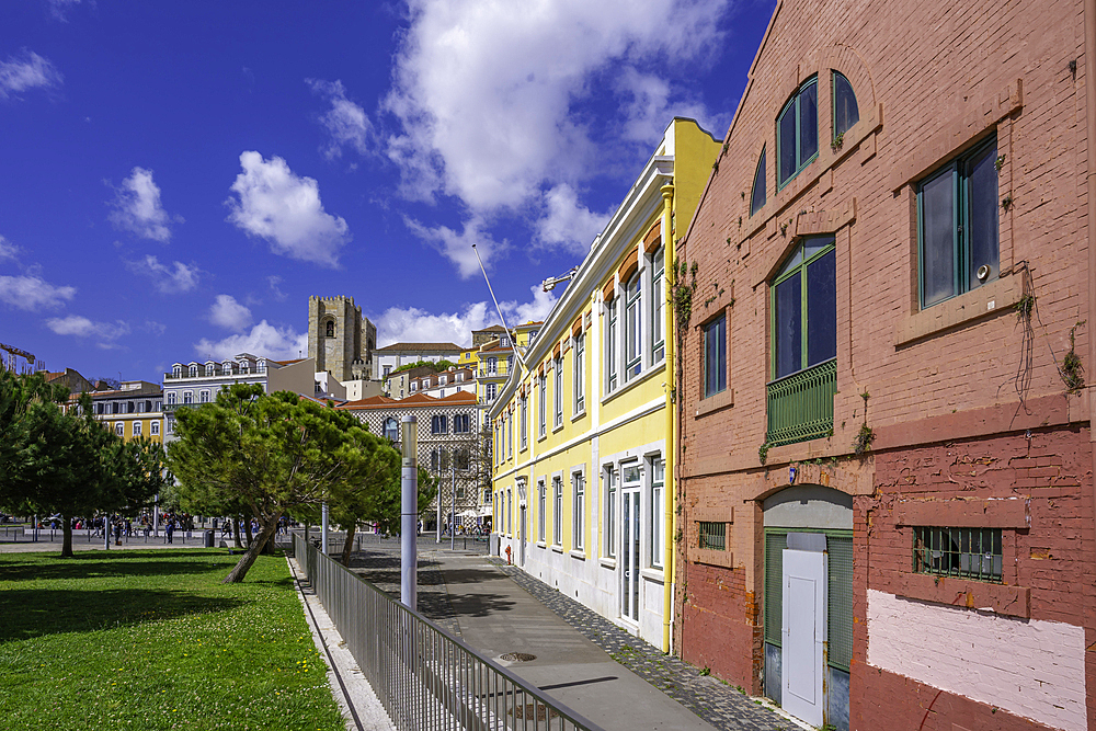 View of Lisbon Cathedral and colourful buildings in the Alfama District on a sunny day, Lisbon, Portugal, Europe