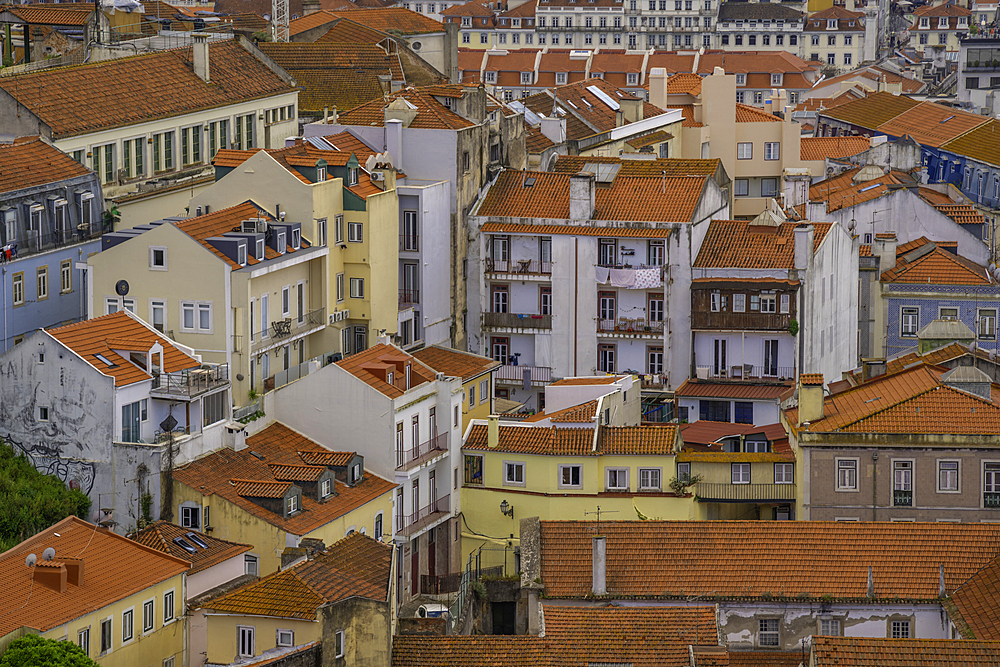 View of rooftops and colourful buildings from Miradouro da Senhora do Monte scenic point on a sunny day in the Alfama District, Lisbon, Portugal, Europe
