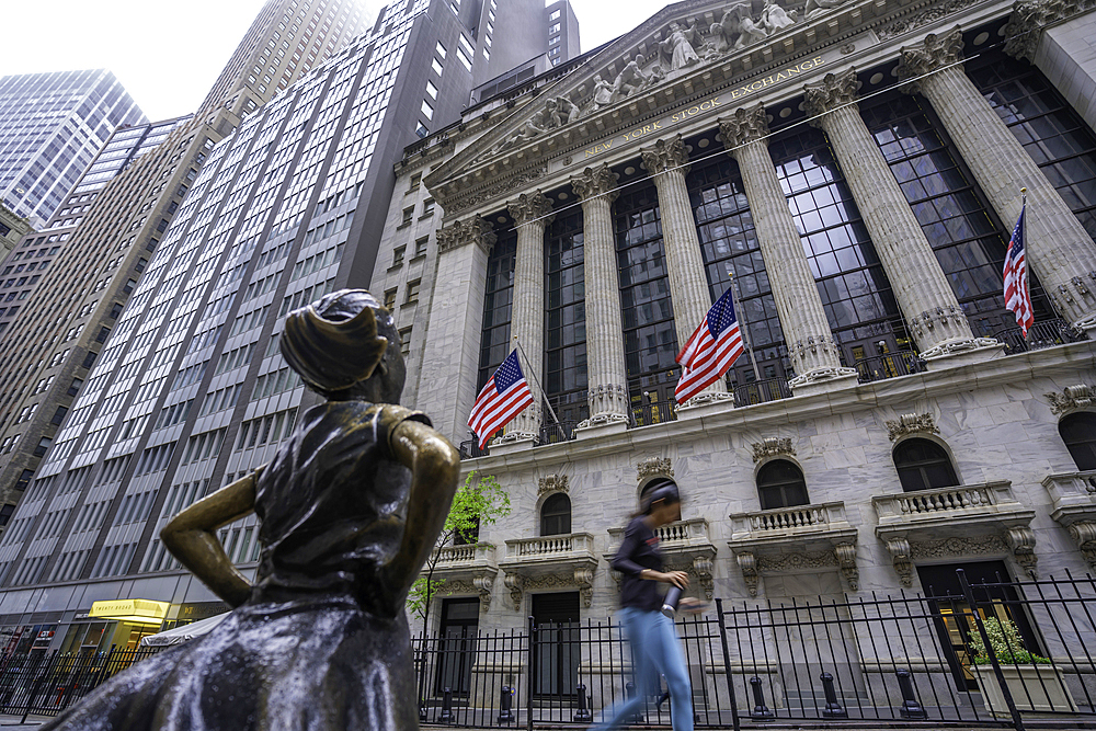 View of exterior of New York Stock Exchange and The Fearless Girl statue in Lower Manhattan, New York City, United States of America, North America