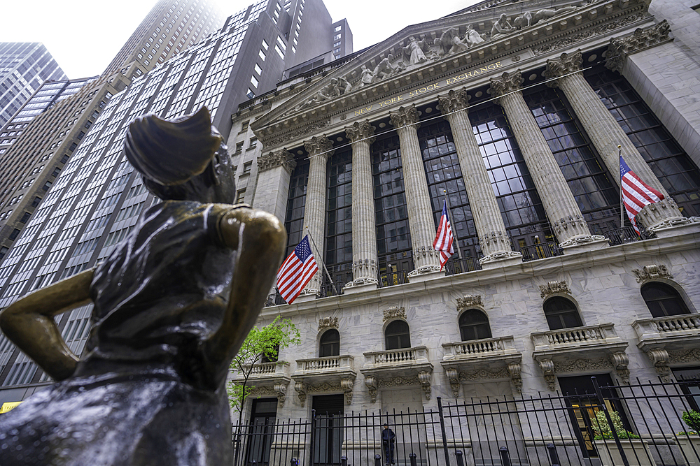 View of exterior of New York Stock Exchange and The Fearless Girl statue in Lower Manhattan, New York City, United States of America, North America