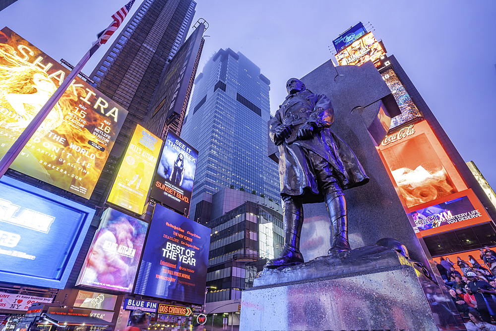View of neon lights in Times Square at dusk, New York City, United States of America, North America