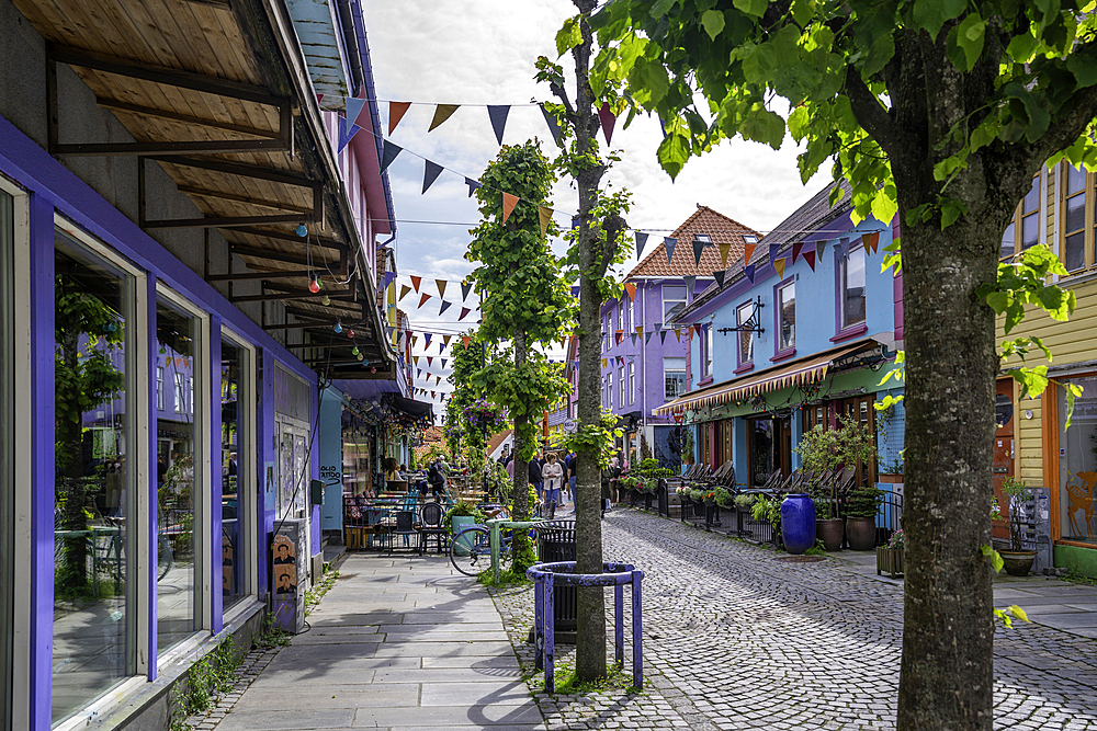View of colourful shops and cafes in Fargegaten during daytime, Stavanger, Norway