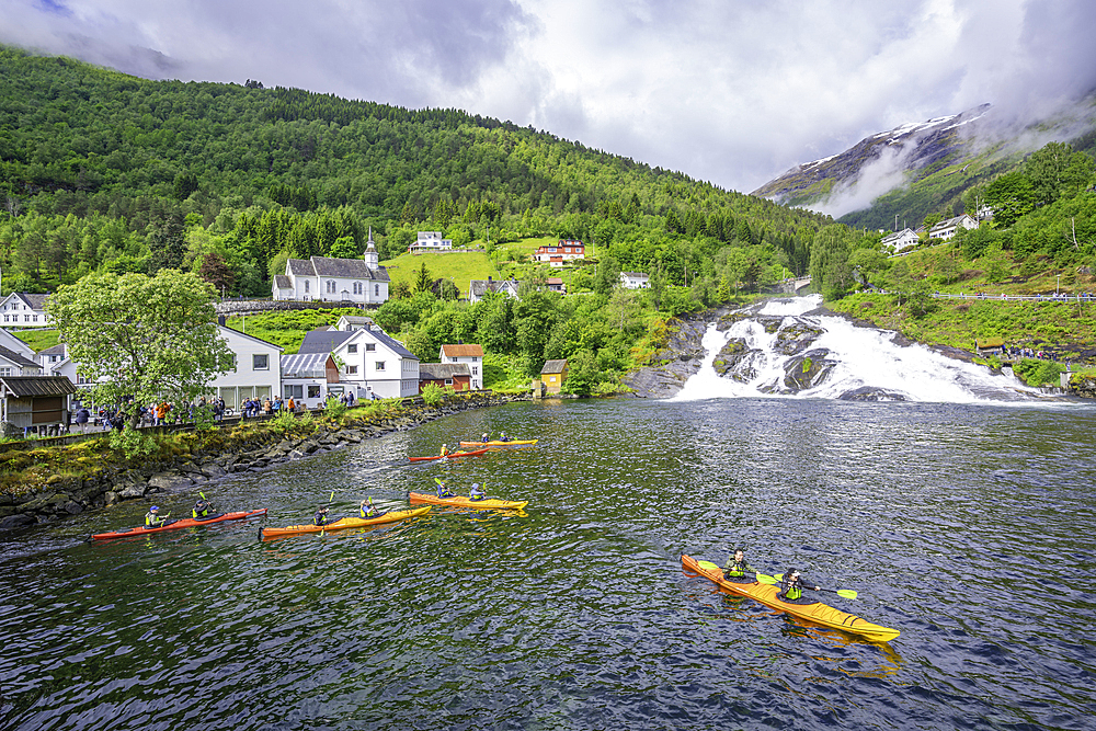 View of Hellesylt waterfall and canoeists in Hellesylt, Sunnylvsfjorden, Stranda Municipality, Norway, Scandinavia, Europe