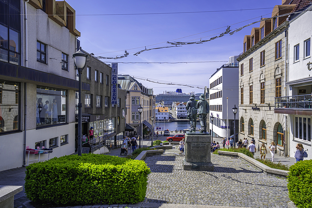 View of Fiskerne statue and buildings on a sunny day, Haugesund, Rogaland County, Norway, Scandinavia, Europe