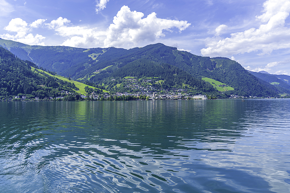 View of Zell am See and Lake Zell from cruise boat on a sunny day, Zell am See, Salzburg, Austria, Europe
