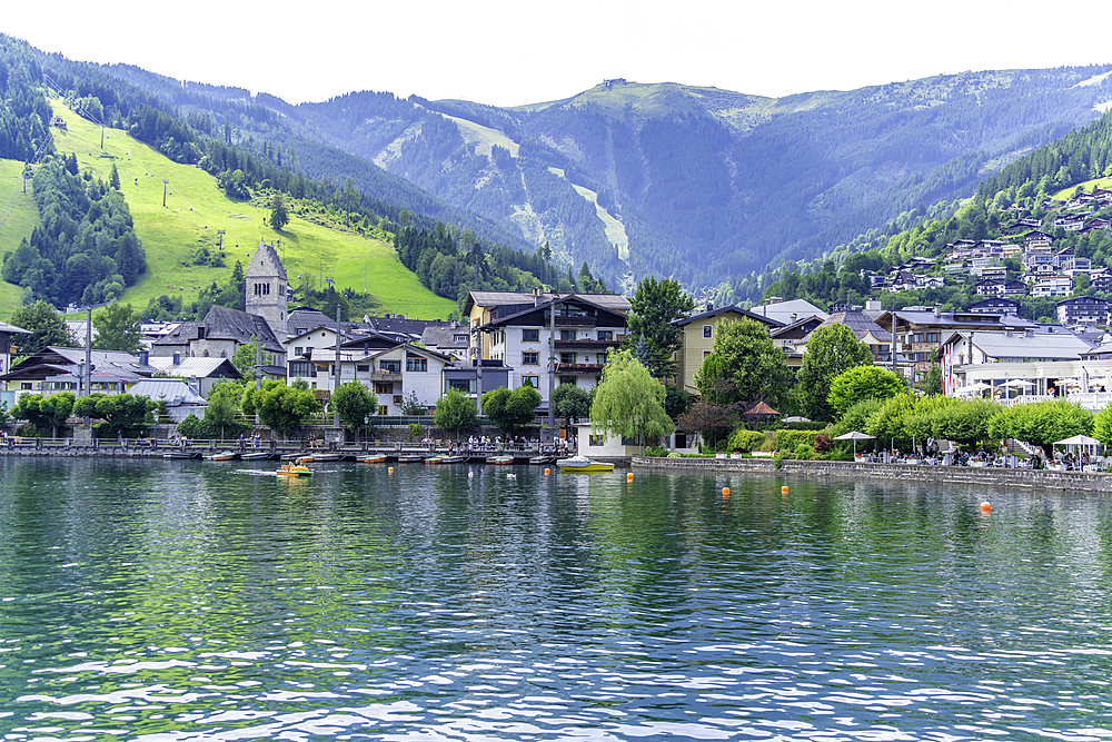 View of the the town and Lake Zell from cruise boat on a sunny day, Zell am See, Salzburg, Austria, Europe