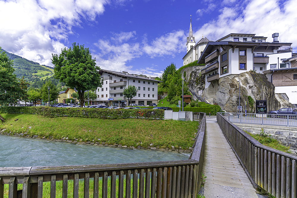 View of Kaprun town and church on the hill on a sunny day, Kaprun, Salzburg, Austria, Europe