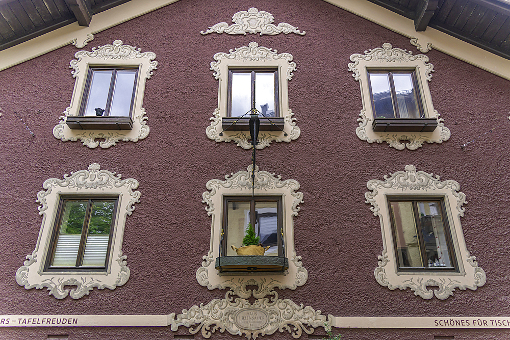 View of colourful facade of chelet in Saalfelden on a sunny day, Zell am See, Salzburg, Austria, Europe
