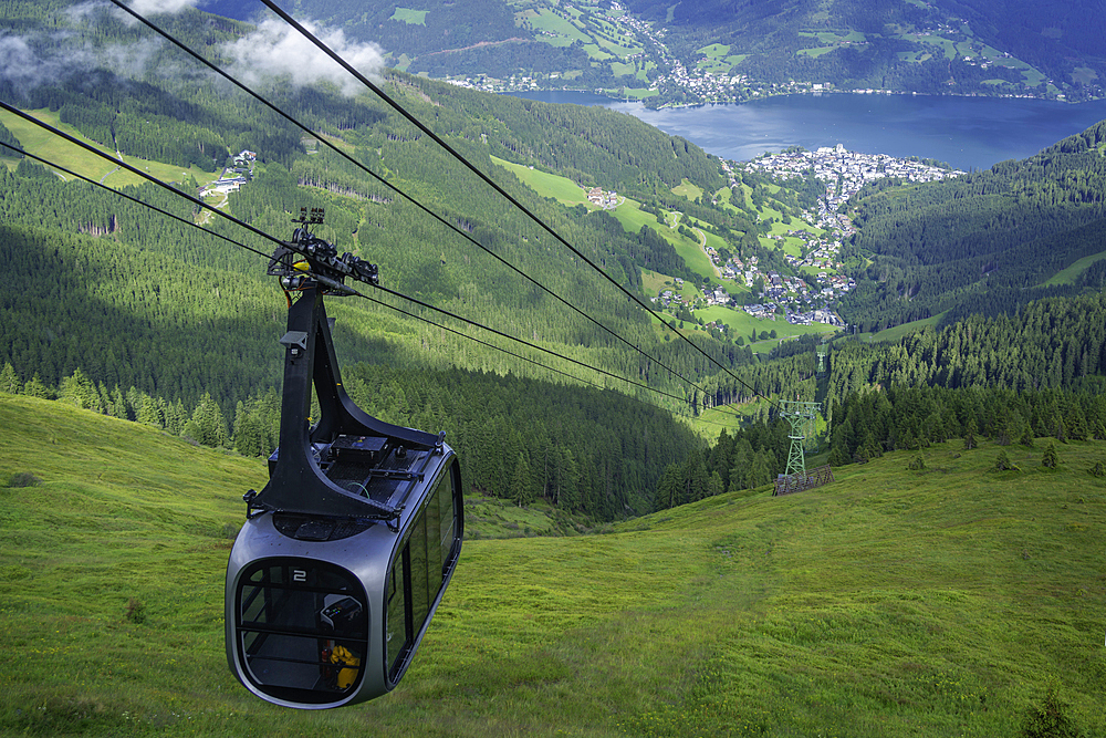 View of cable car, Zell am See and cloud from Schmittenhöhebahn top station 2000m on a sunny day, Zell am See, Salzburg, Austria, Europe