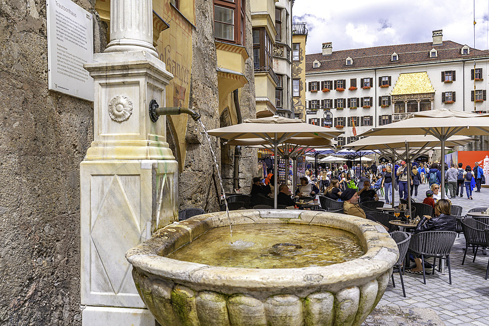 View of cafes and Golden Roof in Herzog-Friedrich-Straße in the old town of Innsbruck on a sunny day in summer, Innsbruck, Tyrol Region, Austria, Europe