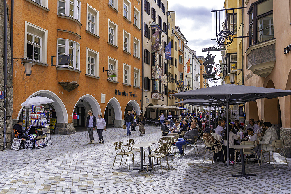 View of cafes and Golden Roof in Herzog-Friedrich-Straße in the old town of Innsbruck on a sunny day in summer, Innsbruck, Tyrol Region, Austria, Europe