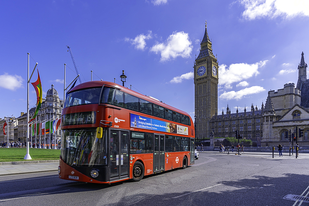 View of Big Ben clock tower and red bus in Parliament Square during summer, Westminster, London, England, United Kingdom, Europe