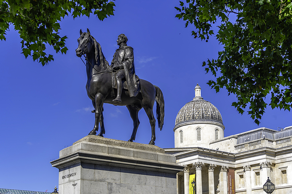 View of Equestrian Statue of King George IV and National Galery in Trafalgar Square during summer, Westminster, London, England, United Kingdom, Europe