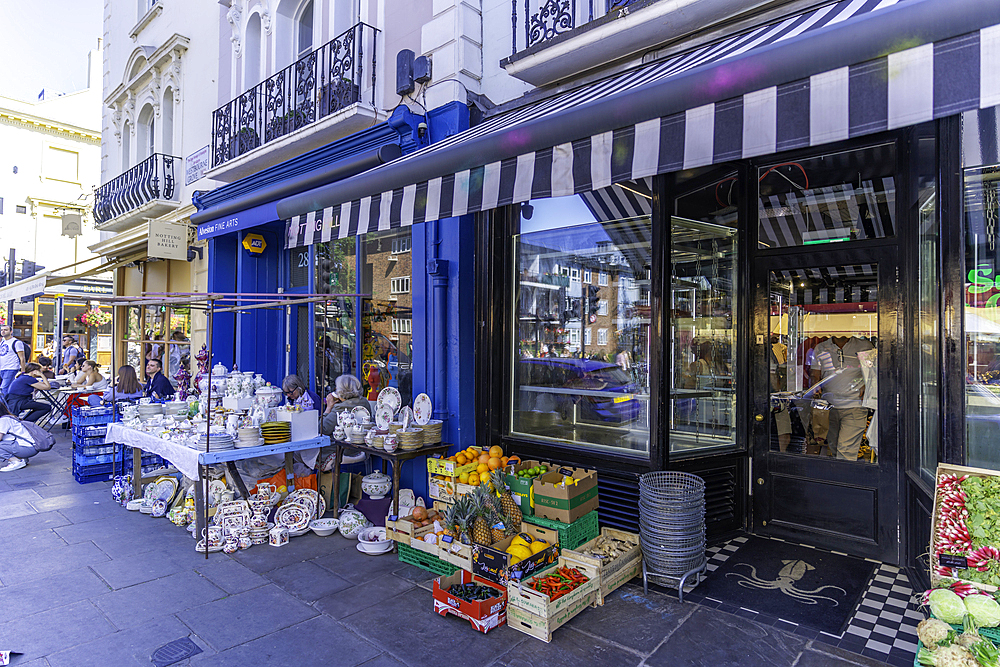 View of colourful shops in Portobello Road during summer, Kensington, London, England, United Kingdom, Europe