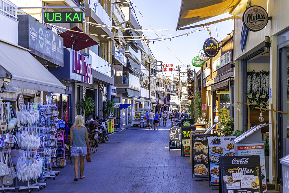 View of shops on main street, Limenas Chersonisou, Crete, Greek Islands, Greece, Europe