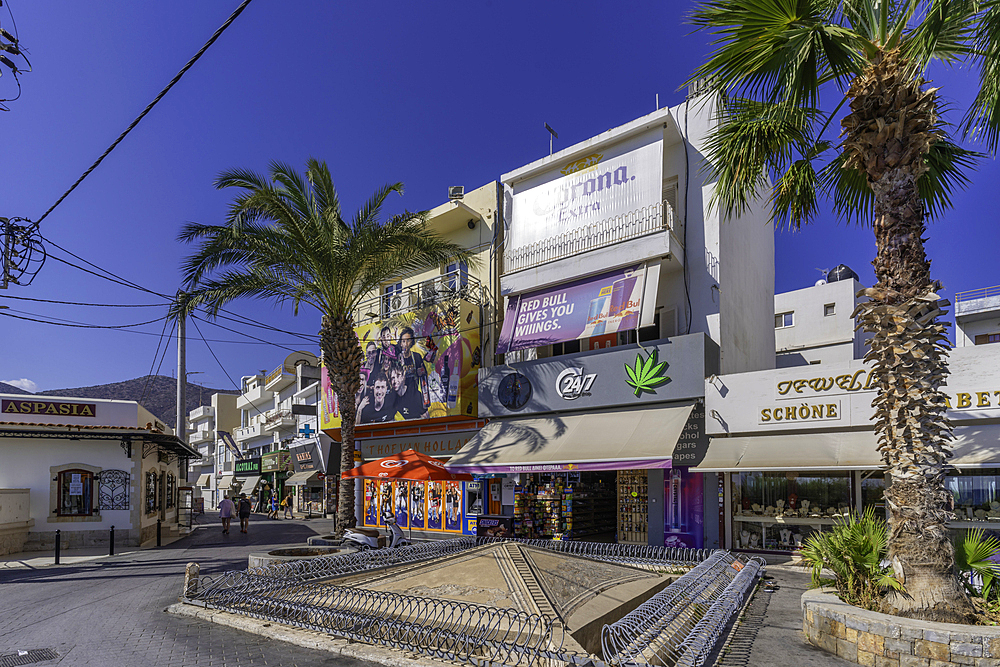 View of shops on main street, Limenas Chersonisou, Crete, Greek Islands, Greece, Europe