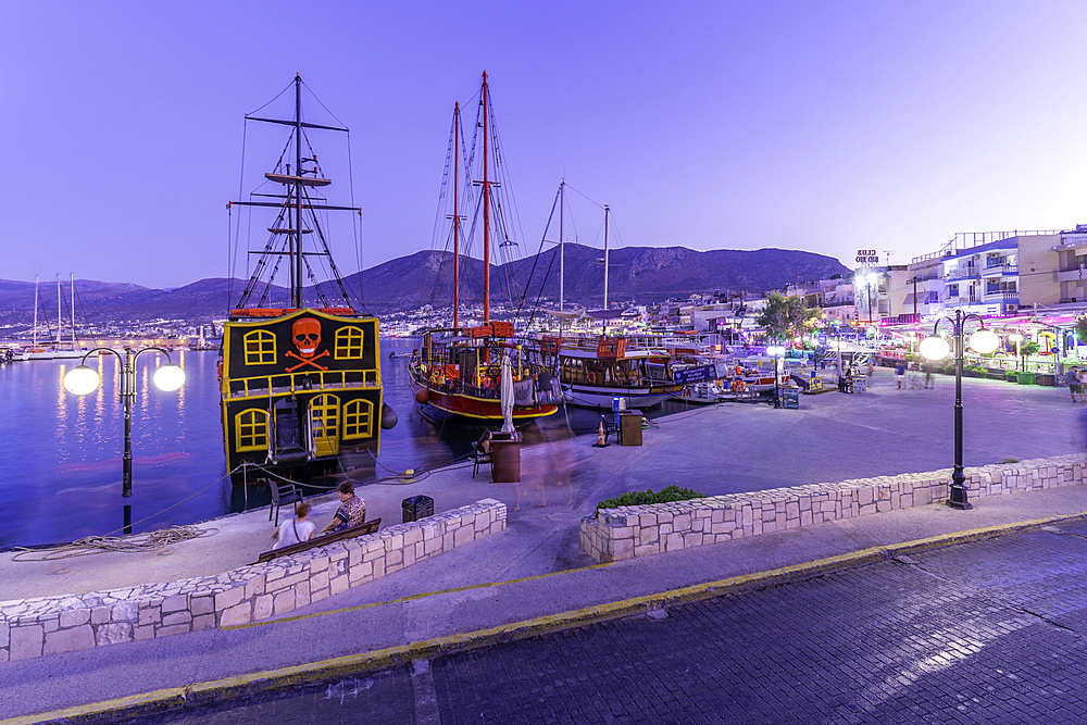 View of boats in Port of Limenas Chersonisou at dusk, Limenas Chersonisou, Crete, Greek Islands, Greece, Europe