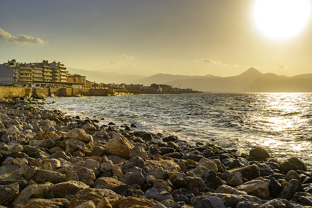 View of coastline at sunset, City of Heraklion, Crete, Greek Islands, Geece, Europe