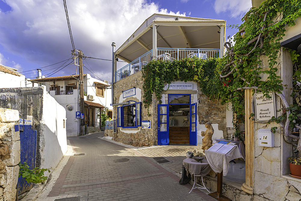 View of taverna's on narrow street in Koutouloufari, Crete, Greek Islands, Greece, Europe