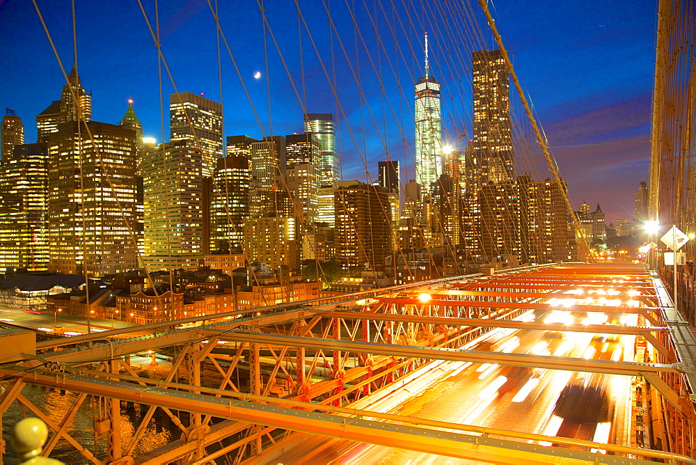 Manhattan skyline from the Brooklyn Bridge at night, New York, United States of America, North America