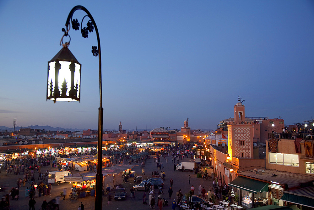 View over market square at dusk, Place Jemaa El Fna, Marrakesh, Morocco, North Africa, Africa