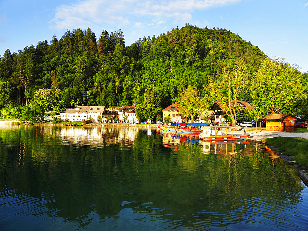 Sunlit buildings on the shore of Lake Bled, Slovenia, Europe