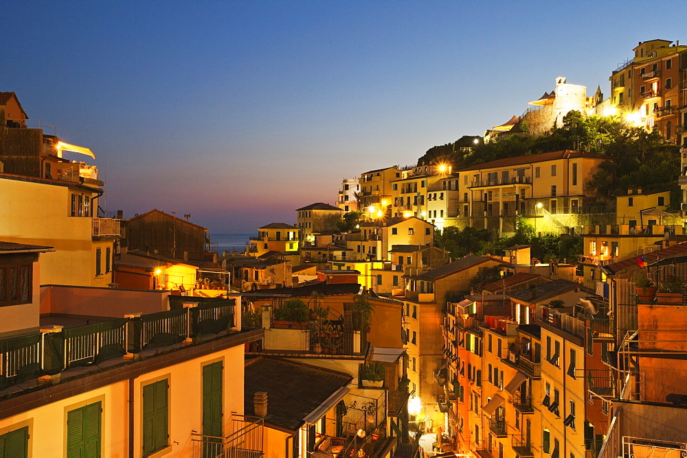 Riomaggiore rooftops and the Castle at dusk, Cinque Terre, UNESCO World Heritage Site, Liguria, Italy, Mediterranean, Europe 