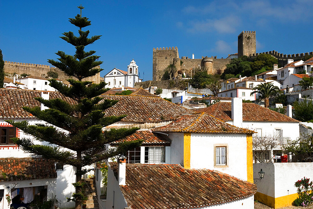 View of old town and castle walls, Obidos, Estremadura, Portugal, Europe