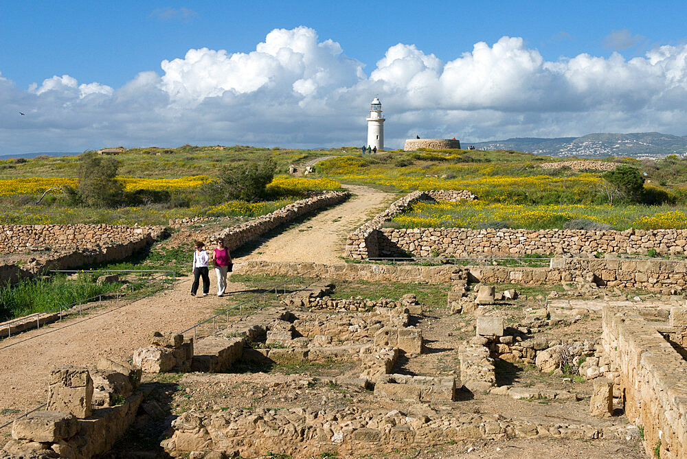 View over ruined Roman town to the lighthouse, The Agora, Archaeological Park, Paphos, UNESCO World Heritage Site, Cyprus, Europe