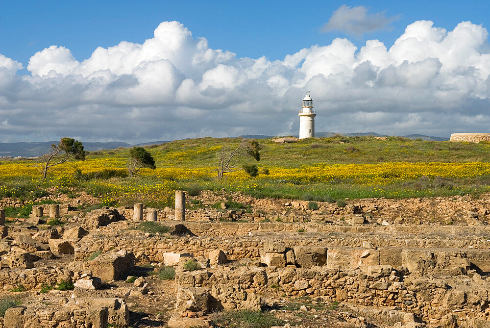 View over ruined Roman town to the lighthouse, The Agora, Archaeological Park, Paphos, UNESCO World Heritage Site, Cyprus, Europe