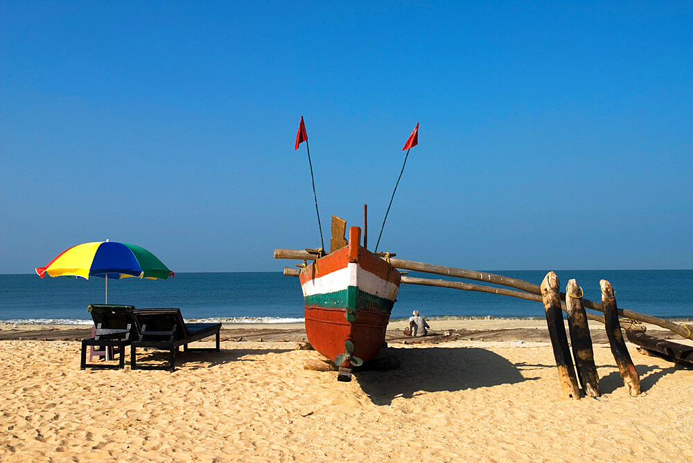 Traditional fishing boat on beach, Benaulim, Goa, India, Asia