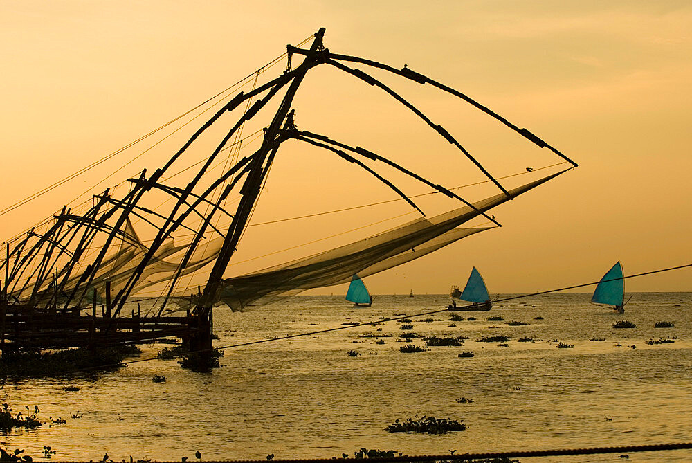 Chinese fishing nets at sunset, Kochi (Cochin), Kerala, India, Asia