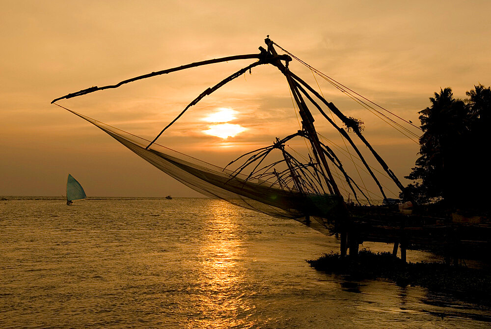 Chinese fishing nets at sunset, Kochi (Cochin), Kerala, India, Asia