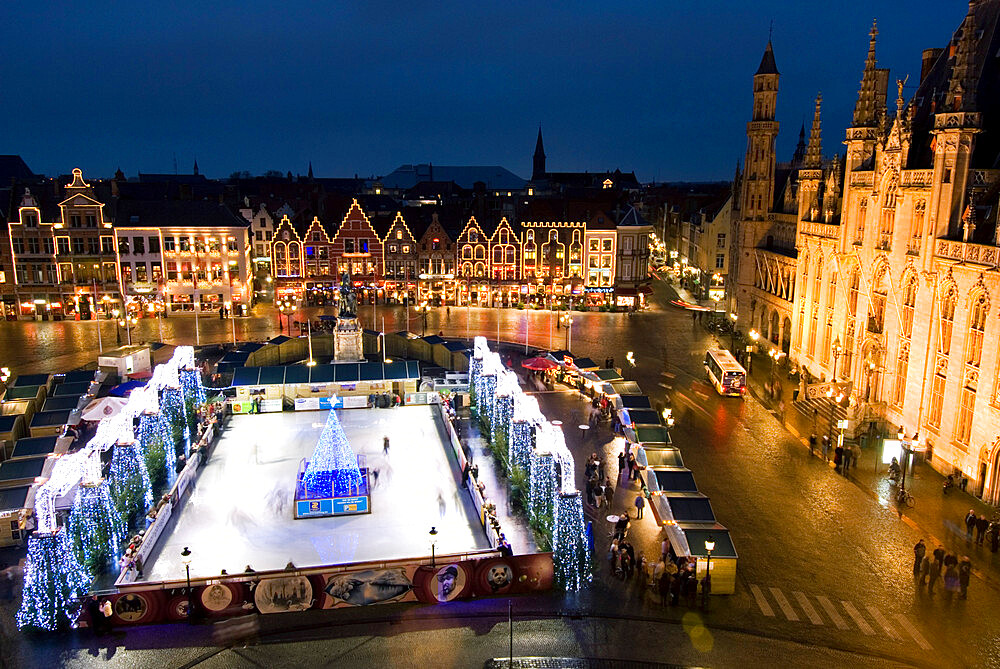 Ice Rink and Christmas Market in the Market Square, Bruges, West Vlaanderen (Flanders), Belgium, Europe