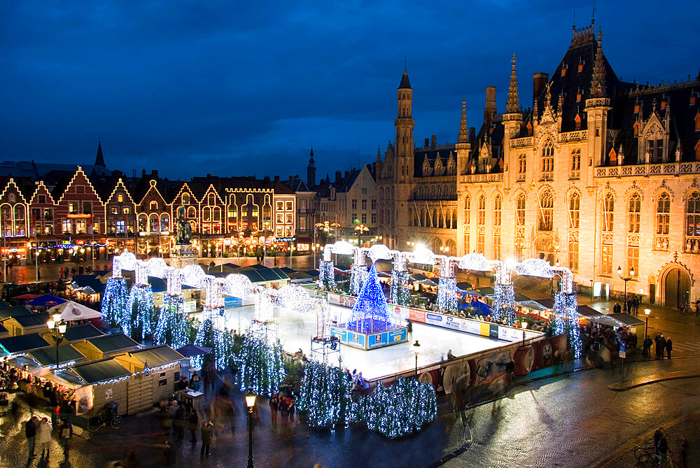 Ice Rink and Christmas Market in the Market Square, Bruges, West Vlaanderen (Flanders), Belgium, Europe