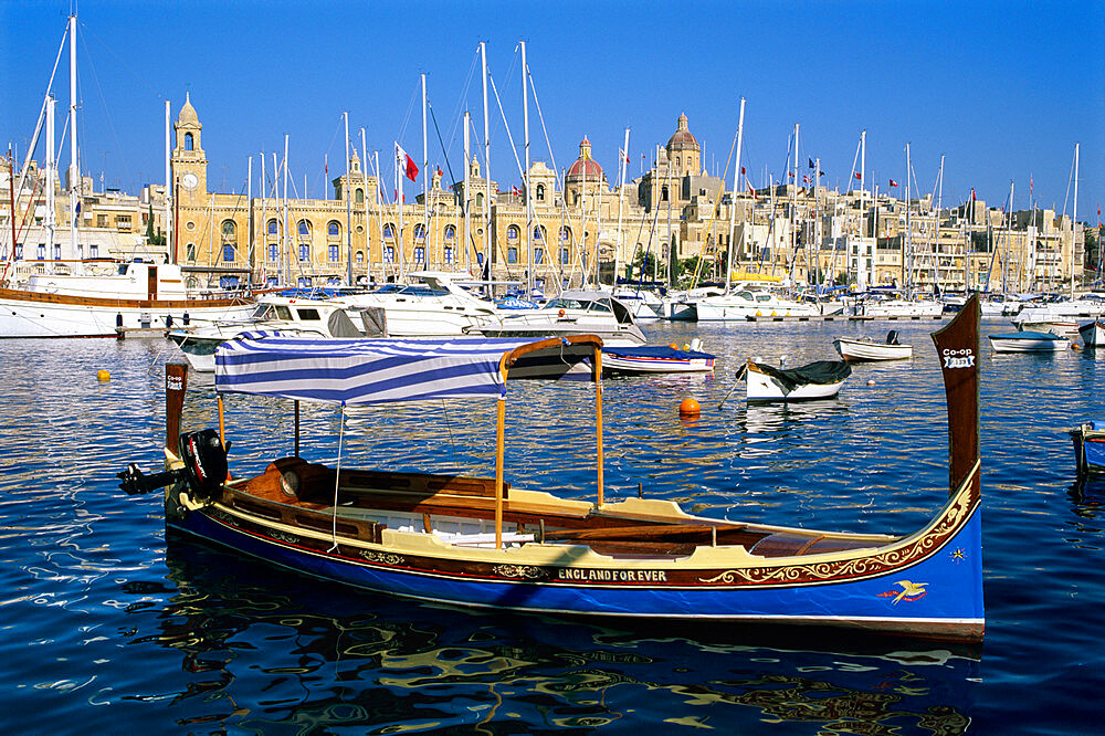 View across Dockyard Creek to Maritime Museum on Vittoriosa with traditional boat, Senglea, Malta, Mediterranean, Europe