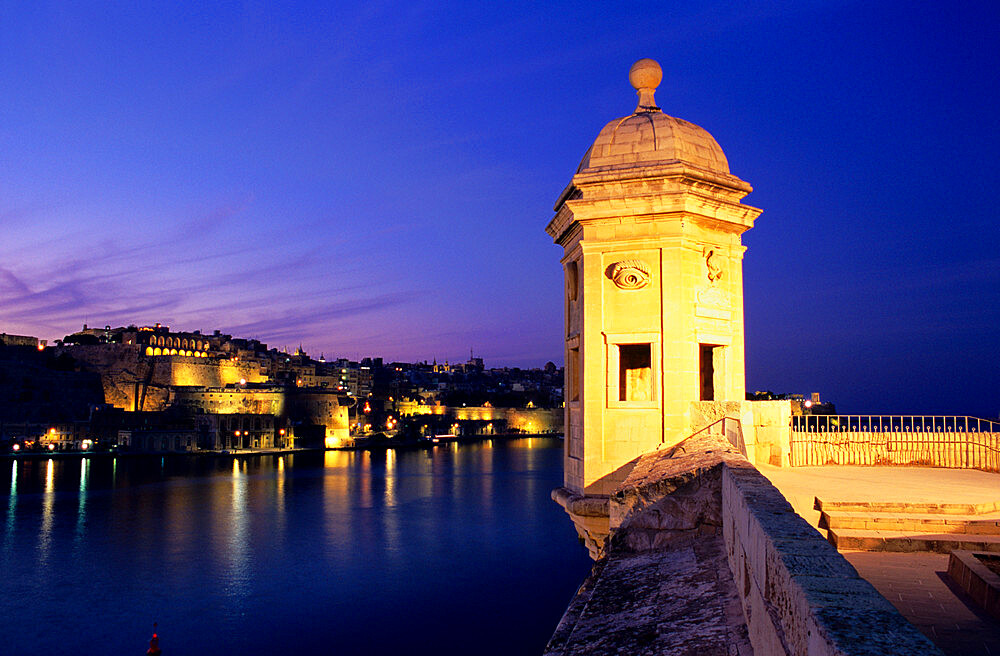 Vedette watchtower and view across the Grand Harbour to Valletta at dusk, Senglea, Malta, Mediterranean, Europe