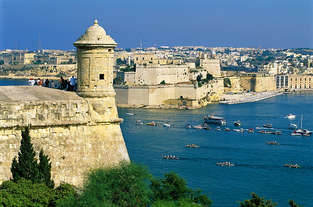 View over Bastions and Grand Harbour to Fort St. Angelo with Rowing Regatta, Valletta, Malta, Mediterranean, Europe