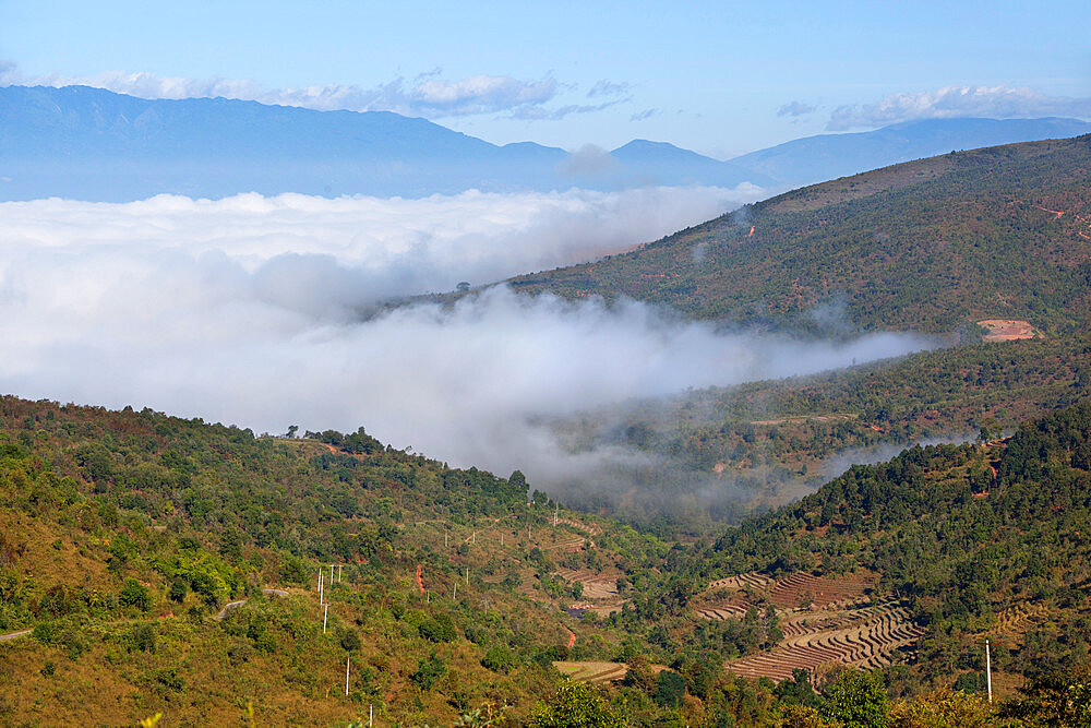 Morning fog over Kengtung and Shan hills on road to Loimwe, near Kengtung, Shan State, Myanmar (Burma), Asia