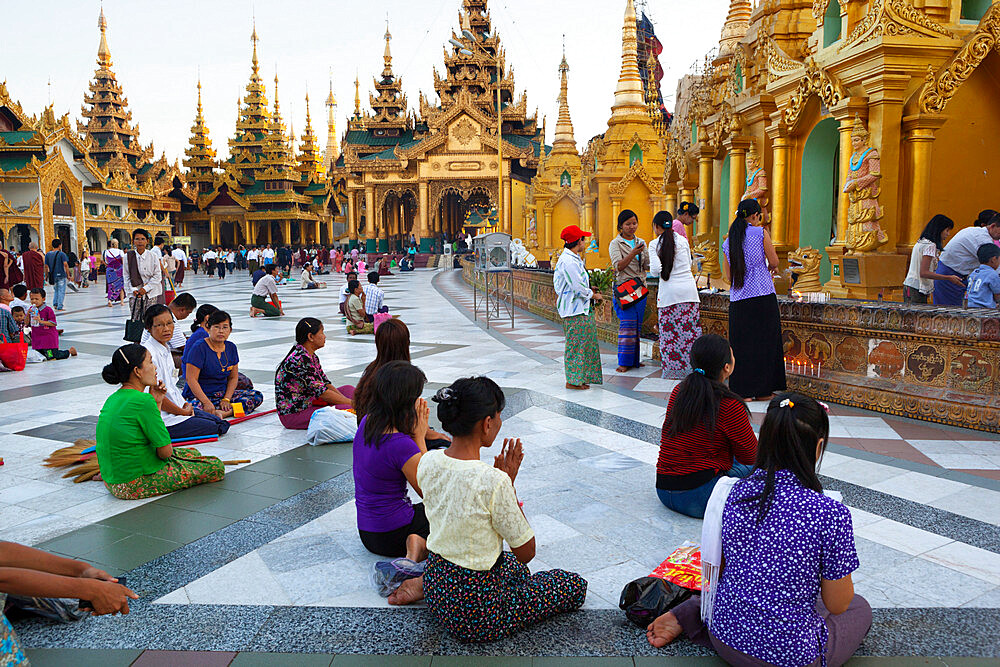 Devotees praying, Shwedagon pagoda, Yangon (Rangoon), Yangon Region, Myanmar (Burma), Asia